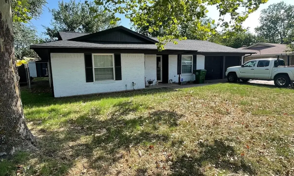 Professional roofing crew working on a residential roof in East Pennsboro